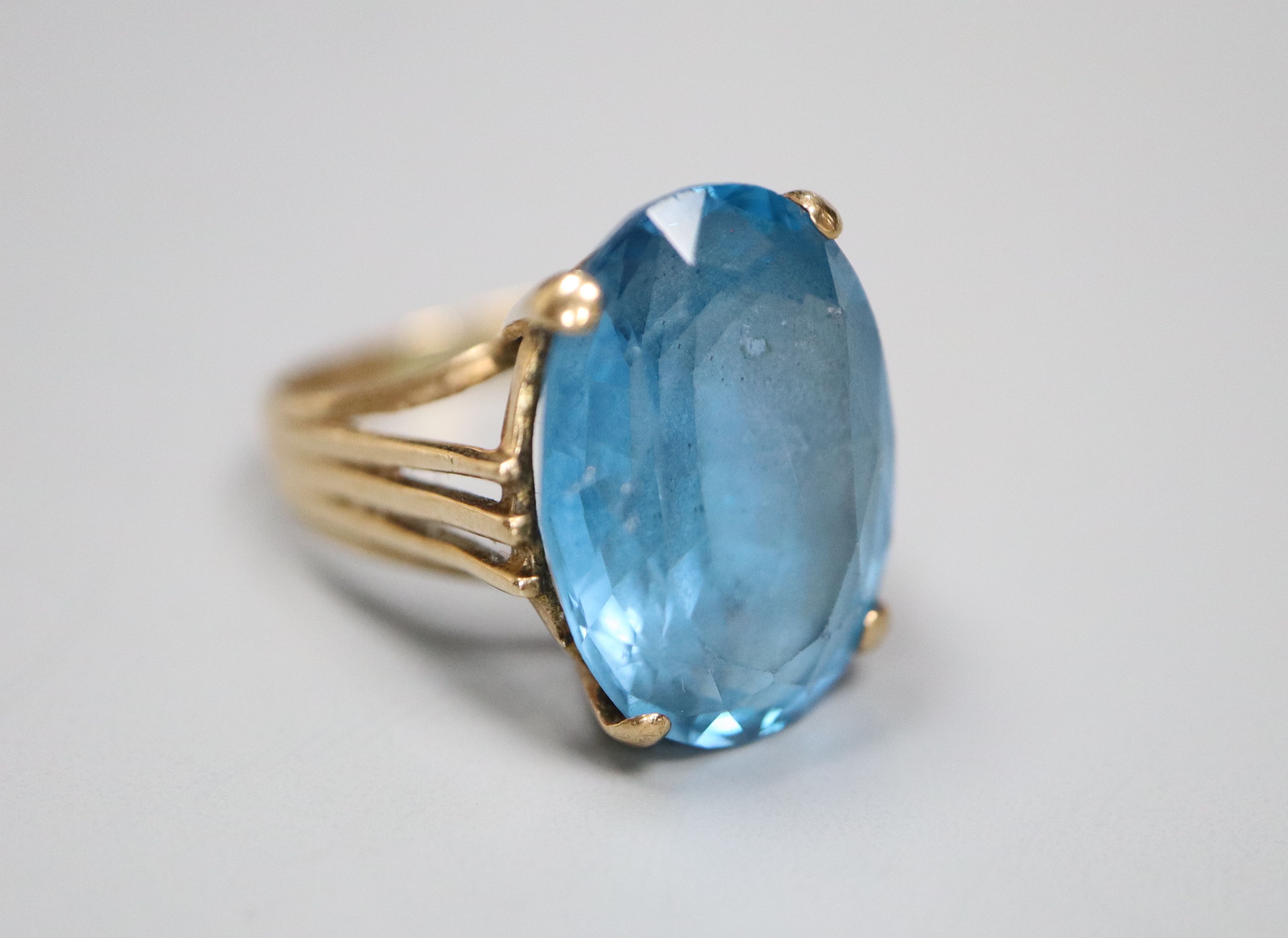 A modern 9ct god and blue paste? set oval dress ring, size K, gross 5.5 grams.